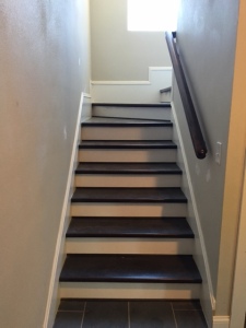 Back staircase. The floors and doors throughout the house are stained Ranch Oak by Sherwin Williams.