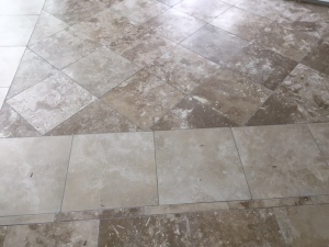 The travertine throughout the entry way was purchased by the pallet from home depot. We purchased 6 pallets for just the downstairs. The color is a combination of classic and ivory. 